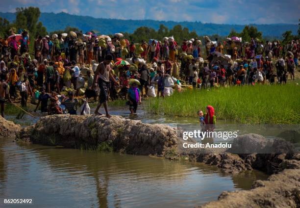 Large group of Rohingya people, fled from ongoing military operations in Myanmars Rakhine state, try to cross the border in Palongkhalii of Cox's...