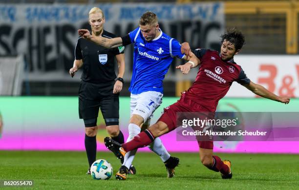 Lukas Muehl of Nuernberg challenges Felix Platte of Darmstadt during the Second Bundesliga match between SV Darmstadt 98 and 1. FC Nuernberg at...