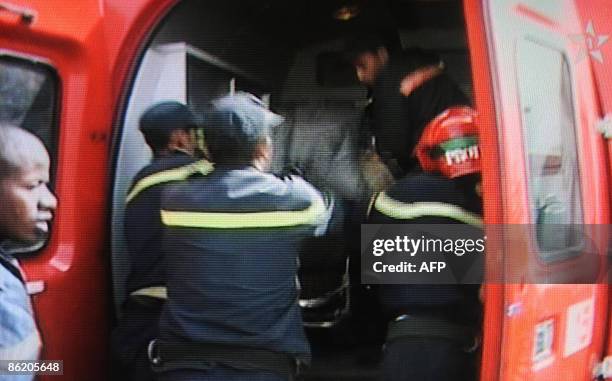 Grab from Moroccan TV shows rescuers evacuating the bodies of four Belgians after a small plane crashed in the Tichka-El Haouz region of southern...