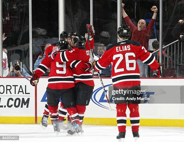 The New Jersey Devils celebrate their second period game winning goal by David Clarkson against the Carolina Hurricanes during Game Five of the...