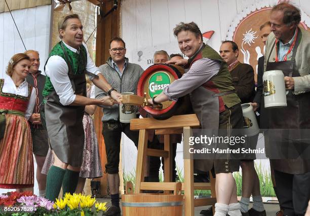 Hans Knauss and Michael Ludwig pose on stage during the opening of Wiener Wiesn-Fest 2017 at Kaiserwiese on September 21, 2017 in Vienna, Austria.