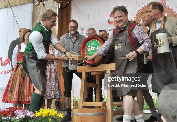 Hans Knauss and Michael Ludwig pose on stage during the opening of Wiener Wiesn-Fest 2017 at Kaiserwiese on September 21, 2017 in Vienna, Austria.