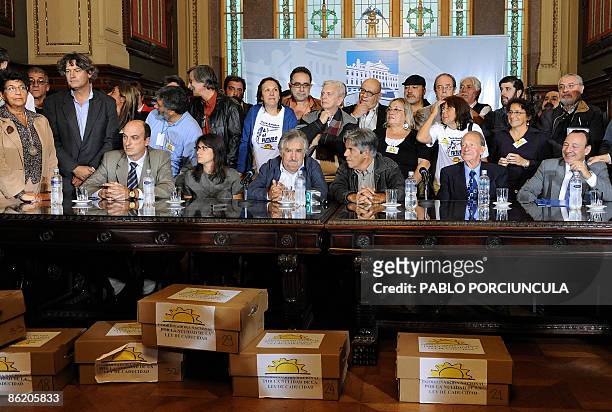 Congress acting President Jose Mujica and members of the Commission to abolish an amnesty law take part in a ceremony after handing on the required...