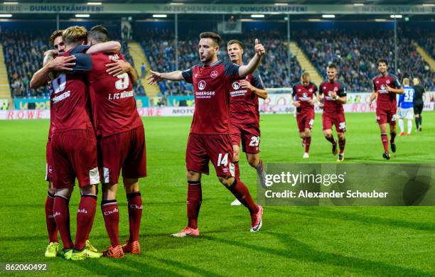 Cedric Teuchert of Nuernberg celebrates the third goal for his team with his teammates during the Second Bundesliga match between SV Darmstadt 98 and...