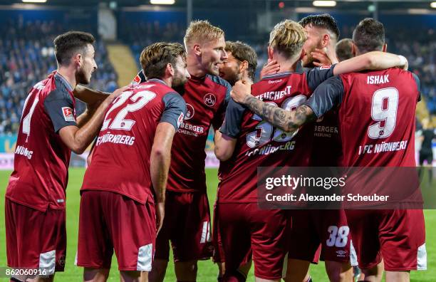 Cedric Teuchert of Nuernberg celebrates the third goal for his team with his teammates during the Second Bundesliga match between SV Darmstadt 98 and...