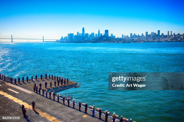 sailors and marines along the perimeter of the uss essex - fleet week imagens e fotografias de stock