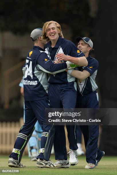 Will Sutherland of Victoria celebrates taking the wicket of Mitchell Starc of NSW during the JLT One Day Cup match between New South Wales and...