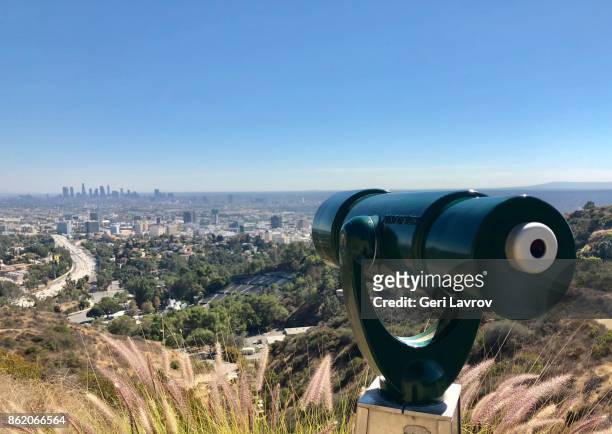 telescope with hollywood hills and downtown los angeles in background - panamint range stock pictures, royalty-free photos & images