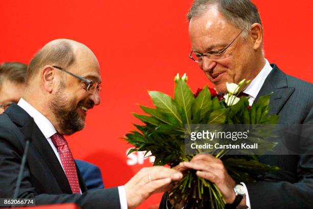 Martin Schulz , head of the German Social Democrats , congrats Stephan Weil , incumbent SPD candidate in yesterday's state elections in Lower Saxony,...