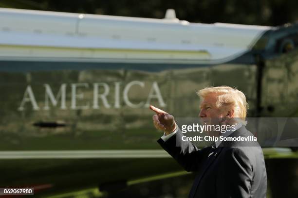 President Donald Trump points as he walks across the South Lawn before departing the White House on Marine One October 16, 2017 in Washington, DC....