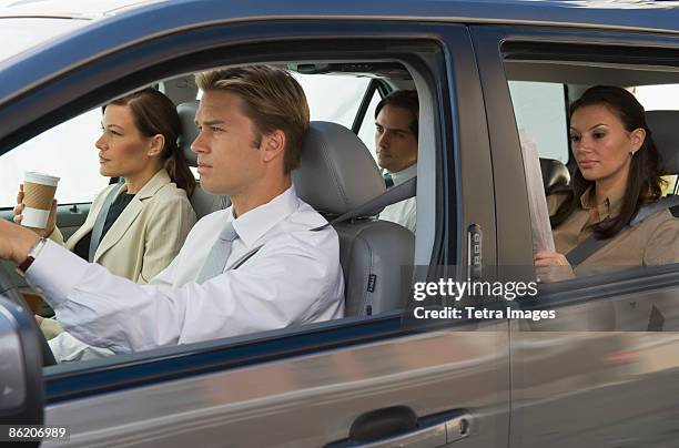 business people car pooling - four people in car fotografías e imágenes de stock