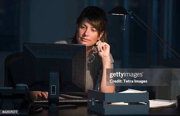 businesswoman working late in office - overdoing stock pictures, royalty-free photos & images