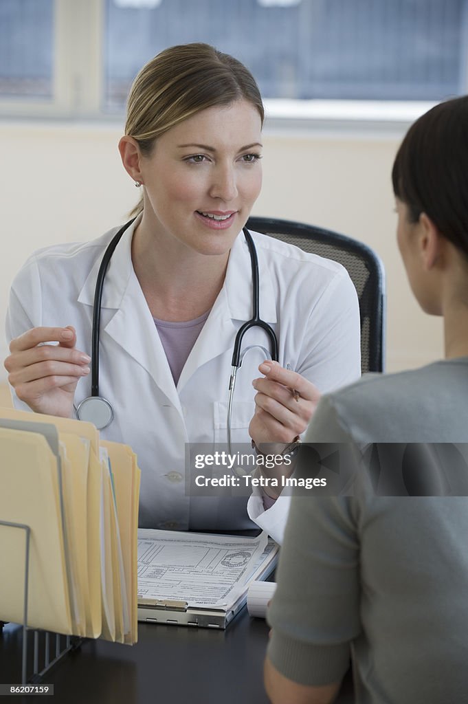 Female doctor consulting female patient