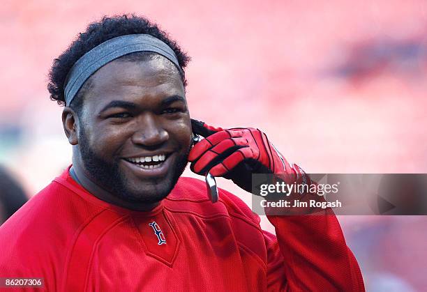 David Ortiz of the Boston Red Sox chats on a cell phone before a game against the New York Yankees at Fenway Park, April 24 in Boston, Massachusetts.