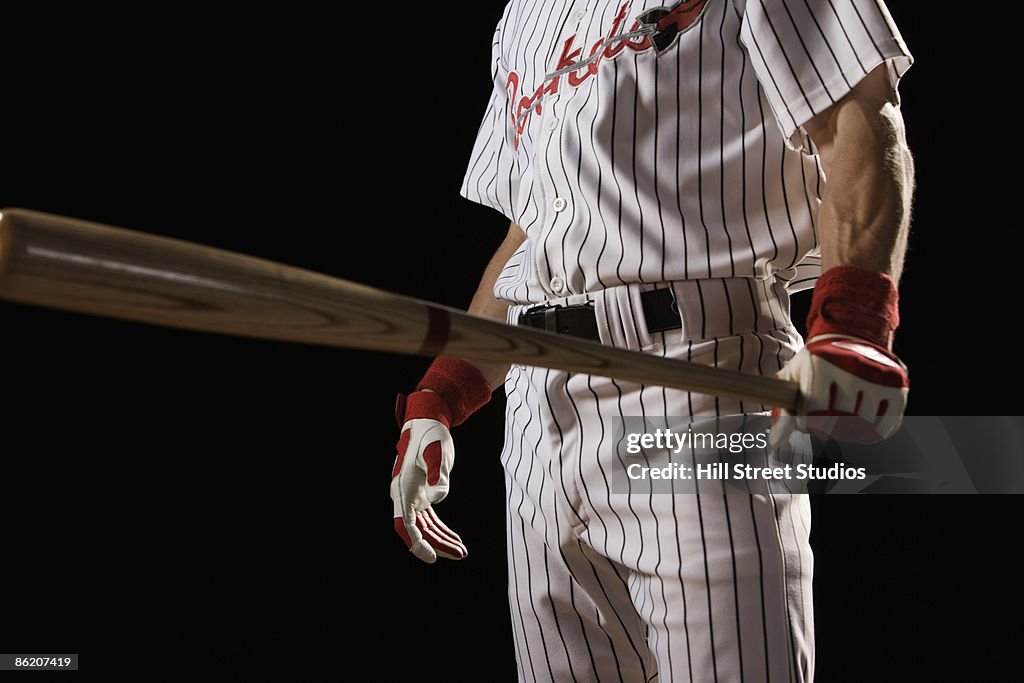 Baseball player holding bat