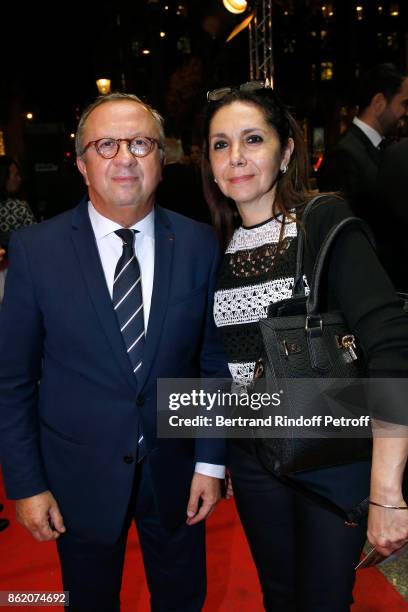 Doctor Roland Levy and his wife attend the "Knock" Paris Premiere at Cinema UGC Normandie on October 16, 2017 in Paris, France.