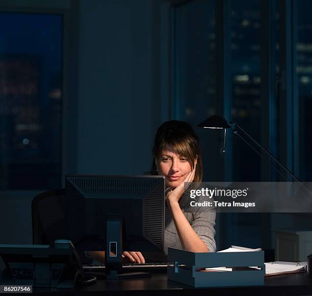 businesswoman working late in office - overdoing stock pictures, royalty-free photos & images