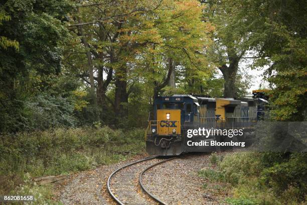 Corp. Freight train backs into a train yard in Louisville, Kentucky, U.S., on Sunday, Oct. 15, 2017. CSX is scheduled to release earnings figures on...