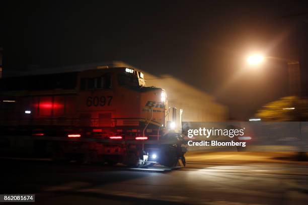 Burlington Northern Santa Fe LLC locomotive leads a CSX Corp. Freight train in Louisville, Kentucky, U.S., on Wednesday, Oct. 11, 2017. CSX is...