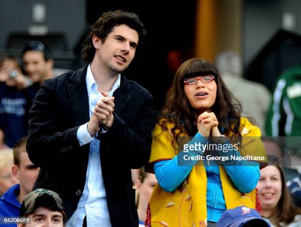 Actor Daniel Eric Gold and actress America Ferrera film a scenen for Ugly Betty during the New York Mets game at Citi Field on April 24, 2009 in New...