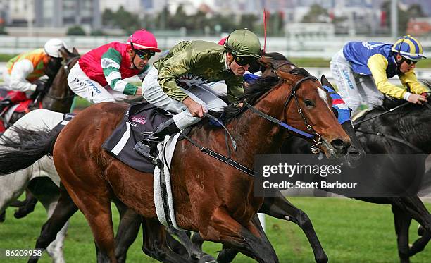 Steven Arnold riding Keano wins the Tasman Handicap during the Anzac Day meeting at Flemington Racecourse on April 25, 2009 in Melbourne, Australia.