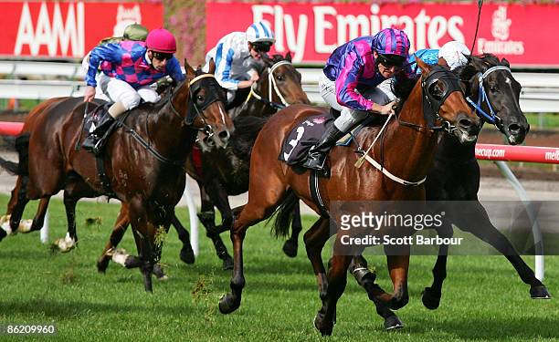 Brad Rawiller riding Extra Zero wins the Anzac Day Stakes during the Anzac Day meeting at Flemington Racecourse on April 25, 2009 in Melbourne,...