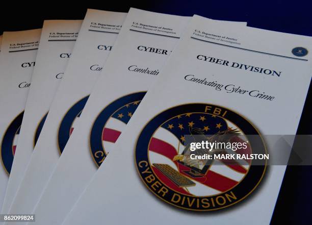 Brochures on combating cyber crime on display at the Cyber Crime Prevention Symposium in Los Angeles, California on October 16, 2017. - Hosting the...