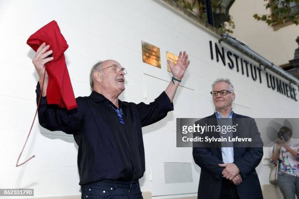 Thierry Fremaux and Jean-Francois Stevenin unveil a commemorative plaque during 9th Film Festival Lumiere on October 16, 2017 in Lyon, France.