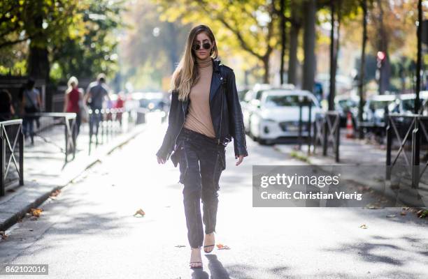 Fashion Blogger Rosa Crespo wearing Faith Connexion pants, heels Saint Laurent, black All Saints leather jacket, beige turtleneck, black Nat & Nin...