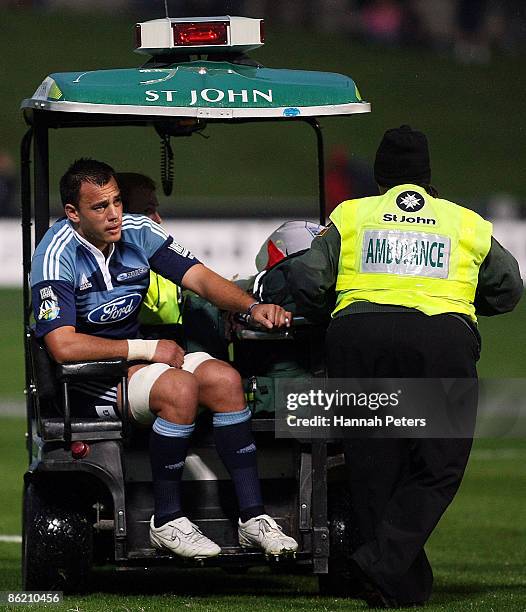 Chris Lowrey of the Blues is taken off injured during the round 11 Super 14 match between the Blues and the Reds at North Harbour Stadium on April...