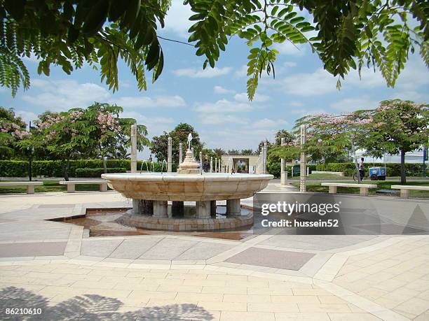 fountain blue sky green tree, azhar park - hussein52 stock pictures, royalty-free photos & images