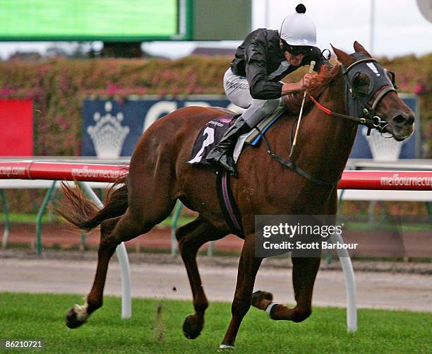 Brad Rawiller riding Chasm wins the Auckland Racing Club Handicap during the Anzac Day meeting at Flemington Racecourse on April 25, 2009 in...