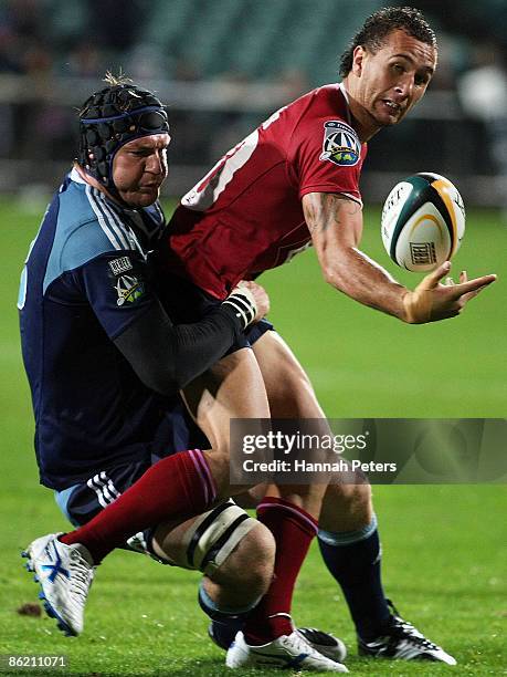 Ali Williams of the Blues brings down Quade Cooper of the Reds during the round 11 Super 14 match between the Blues and the Reds at North Harbour...