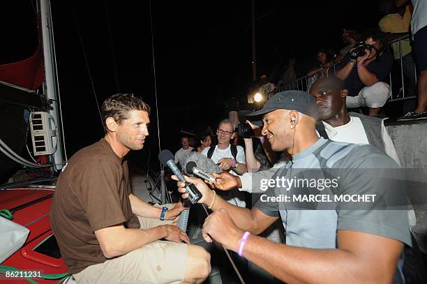 Frenck Erwan Tabarly, skipper of monohull "Athema" talks with journalits on April 25, 2009 upon his arrival at Grand-Bourg harbour on Marie-Galante...