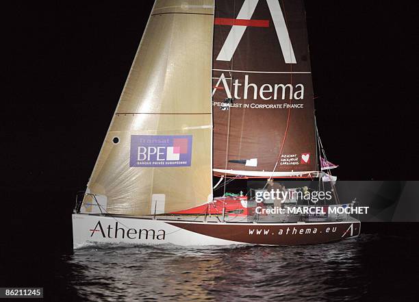 Frenck Erwan Tabarly, skipper of monohull "Athema" crosses the finish line on April 25, 2009 upon his arrival at Grand-Bourg harbour on Marie-Galante...