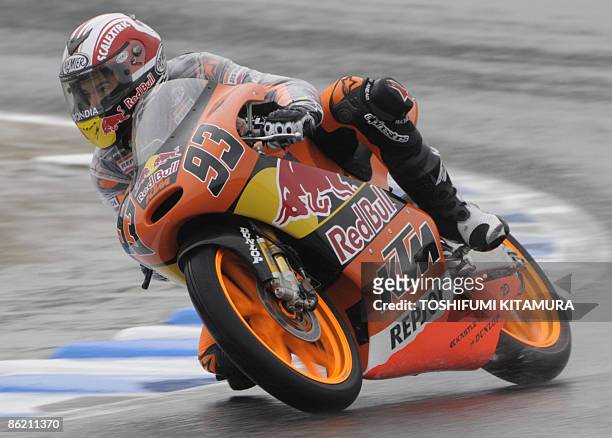 Spainish Marc Marquez rides his KTM during the 125cc free practice session of the MotoGP Japanese Grand Prix at Twin Ring Motegi circuit in Motegi,...