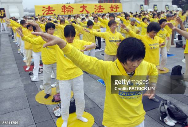 Practitioners of the Falungong spiritual movement gather in Taipei on April 25, 2009 to mark the 10th anniversary of the Chinese government ban. The...