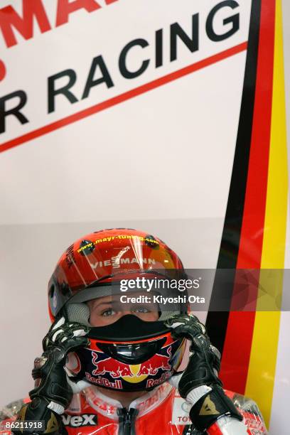 Stefan Bradl of Germany and Viessmann Kiefer Racing looks on from the pits during free practice for the 125cc race of the MotoGP World Championship...