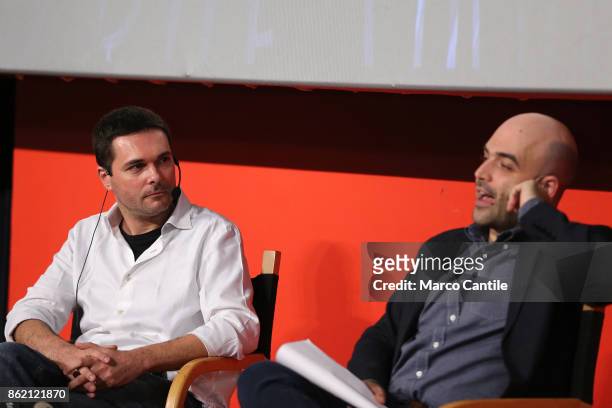 The writer Roberto Saviano, along with writer Saverio Tommasi, during the presentation of his new book, "Bacio Feroce".