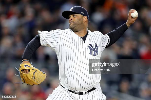 Sabathia of the New York Yankees throws a pitch against the Houston Astros during the first inning in Game Three of the American League Championship...