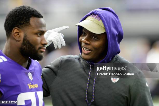 Teddy Bridgewater of the Minnesota Vikings speaks with teammate Latavius Murray before the game against the Green Bay Packers on October 15, 2017 at...