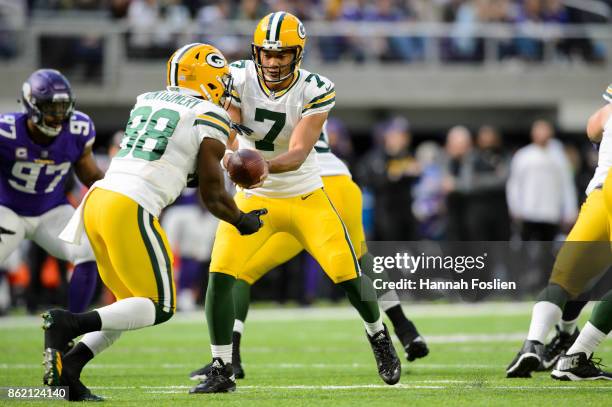 Brett Hundley of the Green Bay Packers hands off the ball to teammate Ty Montgomery against the Minnesota Vikings during the game on October 15, 2017...