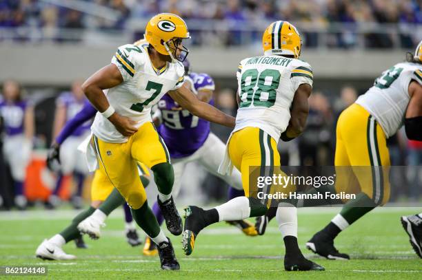 Brett Hundley of the Green Bay Packers hands off the ball to teammate Ty Montgomery against the Minnesota Vikings during the game on October 15, 2017...