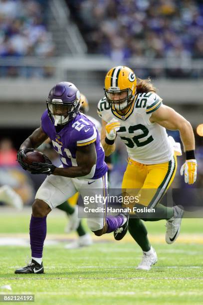 Jerick McKinnon of the Minnesota Vikings carries the ball against Clay Matthews of the Green Bay Packers during the game on October 15, 2017 at US...