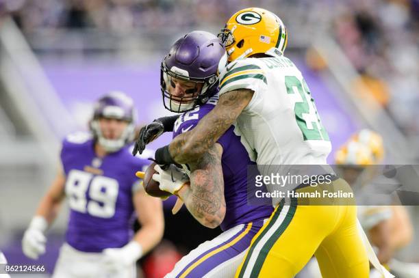 Ha Ha Clinton-Dix of the Green Bay Packers tackles Kyle Rudolph of the Minnesota Vikings after a reception during the game on October 15, 2017 at US...