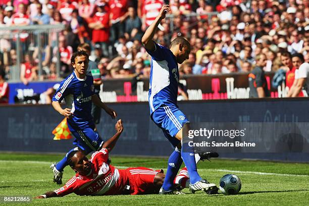 Ze Roberto of Bayern challenges Jermaine Jones of Schalke during the Bundesliga match between FC Bayern Muenchen and FC Schalke 04 at the Allianz...