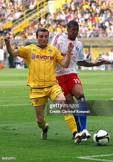 Jerome Boateng of Hamburg tackles Alexander Frei of Dortmund during the Bundesliga match between Borussia Dortmund and Hamburger SV at the Signal...