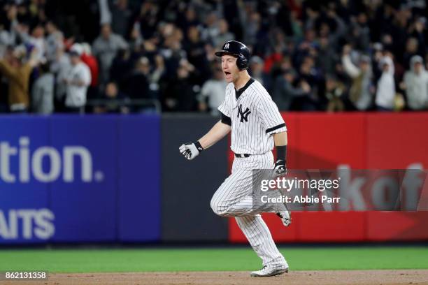 Todd Frazier of the New York Yankees rounds the bases after hitting a 3-run home run against the Houston Astros during the second inning in Game...