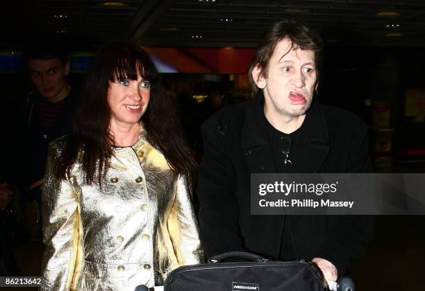 Shane MacGowan and his long time partner Victoria Mary Clarke arrive at Dublin Airport on April 24, 2009 in Dublin, Ireland.