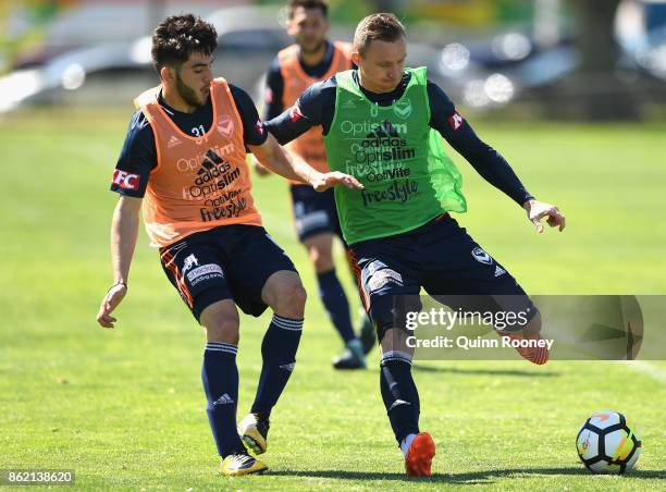 Christian Theoharous and Besart Berisha of the Victory compete for the ball during a Melbourne Victory A-League training session at Gosch's Paddock...